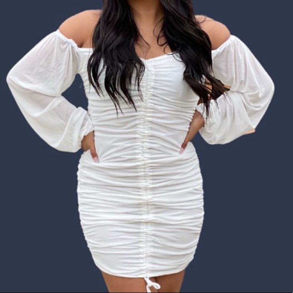 White bodycon dress with long sleeves